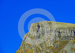 Mountain peak with clear blue skies