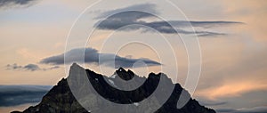 Mountain Peak and Clouds in Sunset Light