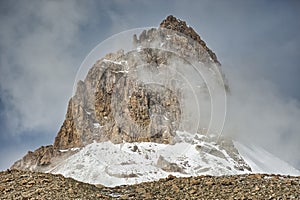 Mountain peak dressed in snow and volcanic rock from Upper Shimshal. Karakoram Himalaya