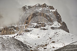 Mountain peak dressed in snow and volcanic rock from Upper Shimshal. Karakoram Himalaya