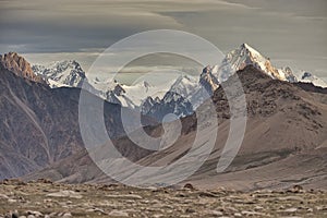 Mountain peak dressed in snow and volcanic rock from Upper Shimshal. Karakoram Himalaya