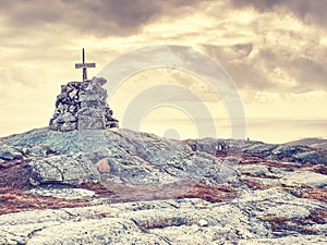 Mountain peak Linesfjellet & x28;230 m& x29;, Linesoya island, Norway. Stone pyramid