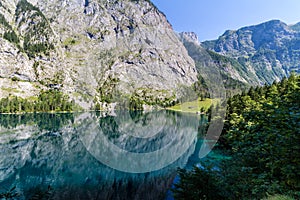 Mountain peak mirroring in lake Obersee