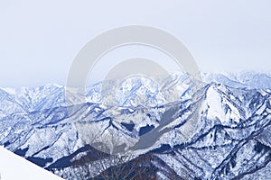 Mountain peak white snow in winter landscape in Japan. Awesome Beautiful Mountain tourism vacation.