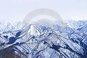 Mountain peak white snow in winter landscape in Japan. Great place for winter sports.