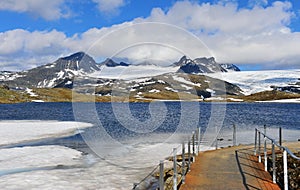 Mountain peaks, floating ice and trekking path