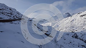 Mountain peaks near Visitor centre on Trollstigen road in snow in Norway in autumn