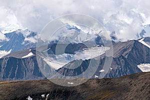 Mountain peaks obscured by clouds in Kluane National Park, Yukon, Canada