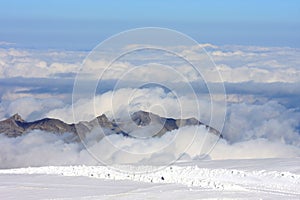 Mountain peaks over the clouds at the Jungfraujoch