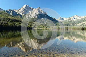 Mountain peaks reflecting in Redfish lake.