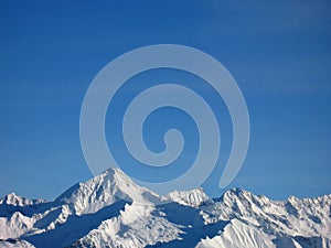 Mountain peaks in snow photo