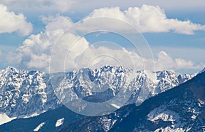 Mountain peaks snow and clouds background