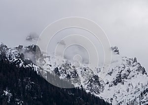 mountain peaks sticking out of the clouds