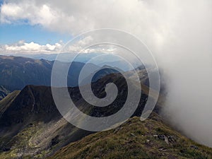 Mountain peeks surrounded by clouds