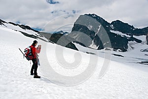Mountain photographer on glacier