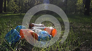 Mountain of plastic bottles, garbage, waste lies in a forest in the nature, garbage in the woods, plastic