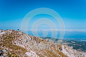 Mountain plateau, quaint stone formations and clouds scenery on the horizon. Rocky highland on Kefalonia Island, Greece