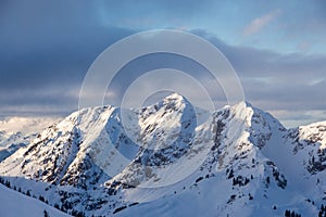 Mountain portrait Birnhorn Saalbach dramatic clouds perfect blue sky light scenic mood