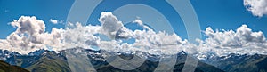 Mountain range Albula Alps, view from Davos parsenn. blue sky with clouds photo