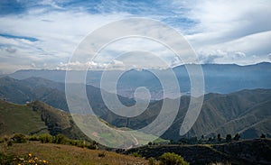 a mountain range with a city in the background