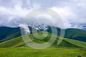 Mountain range clouds panoramic landscape.