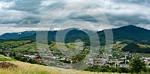 Mountain range clouds panoramic landscape.