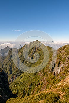 Mountain range with fog and blue sky