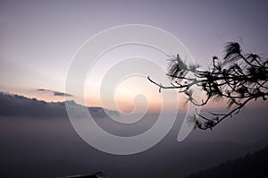 Mountain range of fog at daybreak