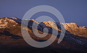 Mountain range illuminated by the rising sun