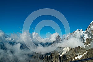 the mountain range of mont blanc covered with snow at punta hellbronner in courmayeur