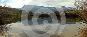 Mountain range reflected on a lake photo