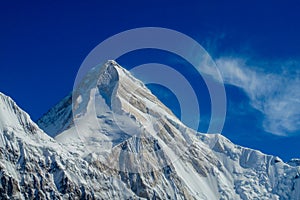 Mountain range snow peak and slope of Khan Tengri