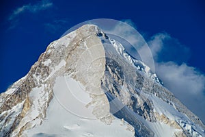 Mountain range snow peak and slope of Khan Tengri