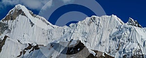 Mountain range snow peaks above glacier covered with snow