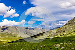 Mountain range in the subpolar urals on a summer day photo