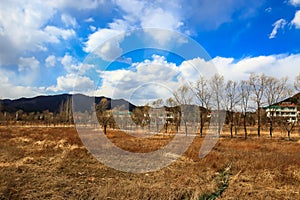 mountain range on a sunny day with clouds