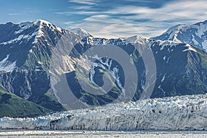Mountain range towers over Hubbard Glacier, Disenchantment Bay, Alaska, USA