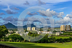 Mountain range viewed across a residential zone with many habitations and high rise condos