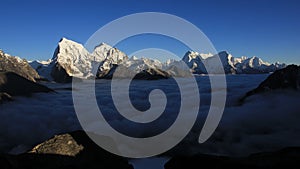 Mountain ranges of the Himalayas and sea of fog. View from Gokyo Peak