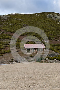 Mountain refuge in Puerto de Honduras, Extremadura, on a sunny day with clouds photo