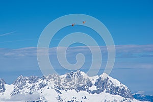 Mountain rescue helicopters above Alps, Kitzbuhel, Austria