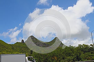 Mountain ridge along highway and cloud. Port Louis, Mauritius