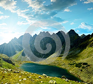 Mountain ridge Bast with lake Hincovo pleso at sunset, High Tatras, Slovakia