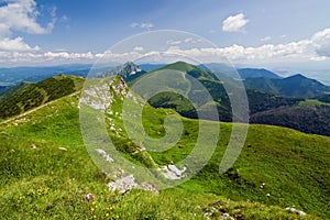 Mountain-ridge and blue sky with clouds