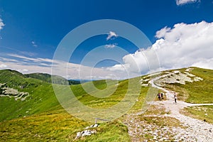 Mountain ridge and blue sky with clouds