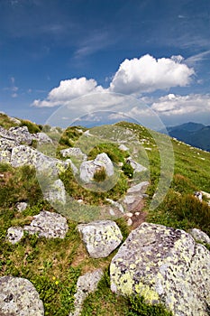 Mountain ridge and blue sky with clouds