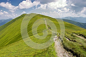 Mountain Ridge with Cloudy Skies in the Summer