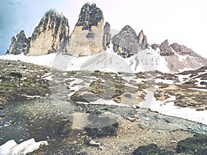 The mountain river against the sharp mountains in Dolomites