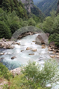 The mountain river with blue water in Abkhazia