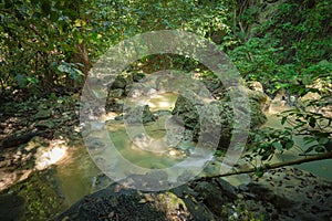 Mountain river, boulders in the tropical jungle on a sunny day. Wide angle